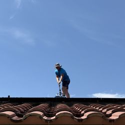 Blue Skye Cleaning Services - Alex up on our roof careful cleaning our panels! Thanks again!
