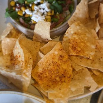 Moxies - Fresh smashed guacamole- tajin chips and roasted corn, pico de gallo, feta cheese, lime - New American Near Me - Scottsdale, Arizona Moxies - Fresh smashed guacamole- tajin chips and roasted corn, pico de gallo, feta cheese, lime - New American Near Me - Scottsdale, Arizona