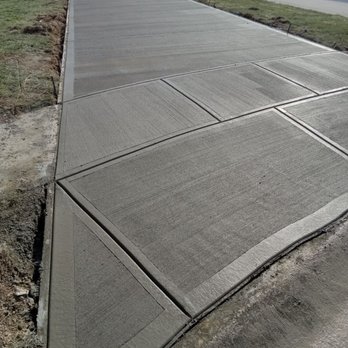 Dirt Werks Ag - a concrete sidewalk with a crack in the middle - Excavation Services Near Me Dirt Werks Ag - a concrete sidewalk with a crack in the middle - Excavation Services Near Me