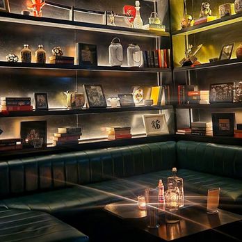 Gokudo - a dimly lit room with a green couch - Cocktail Bars Near Me - Montreal, Quebec Gokudo - a dimly lit room with a green couch - Cocktail Bars Near Me - Montreal, Quebec