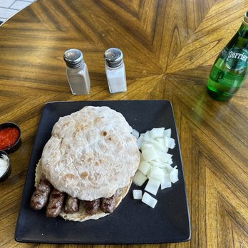 European Gusto - One of the very best meals ever, Cevapi!  Grilled beef links between lepinja (pita type bread) with raw onion. - Beer, Wine & Spirits Near Me - Denver, Colorado