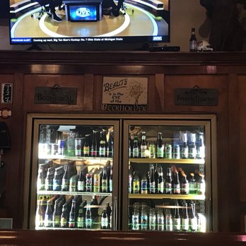 Sam's Pizza - Bottles behind the bar - Pizza Near Me - Iowa City, Iowa Sam's Pizza - Bottles behind the bar - Pizza Near Me - Iowa City, Iowa