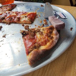 Riviera Bowl & Pizzeria - A slice of pepperoni pizza from The Riviera Bar And Grill
