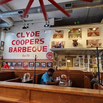 Clyde Cooper's Barbecue - people sitting at tables in a restaurant - Barbeque Near Me - Raleigh, North Carolina