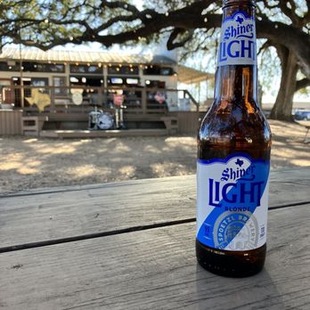 Albert Icehouse & Dancehall - a beer bottle on a picnic table - Bars Near Me - Stonewall, Texas Albert Icehouse & Dancehall - a beer bottle on a picnic table - Bars Near Me - Stonewall, Texas