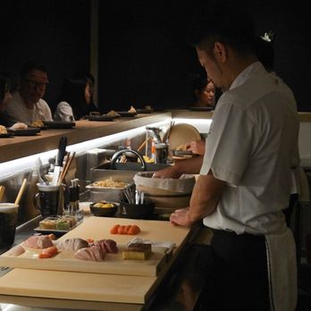 Kuramoto - Chef with ingredients out and ready - Sushi Bars Near Me - Tustin, California Kuramoto - Chef with ingredients out and ready - Sushi Bars Near Me - Tustin, California