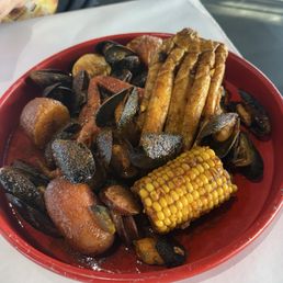 Mussels, Snow Crab, potatoes, sausage, corn Mussels, Snow Crab, potatoes, sausage, corn