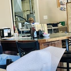 West Side Cafe - Person smoking in the kitchen.