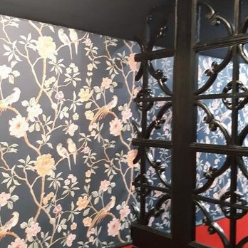 Rodriguez Construction - a bathroom with a wallpapered wall - Demolition Services Near Me Rodriguez Construction - a bathroom with a wallpapered wall - Demolition Services Near Me