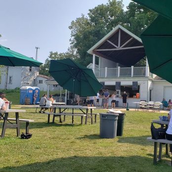 Riley Tavern - people sitting at picnic tables under umbrellas - Bars Near Me - Verona, Wisconsin Riley Tavern - people sitting at picnic tables under umbrellas - Bars Near Me - Verona, Wisconsin
