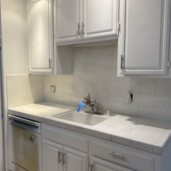 Logar Property Solutions - Cabinets , sink and old tile renovation - Handyman Near Me
