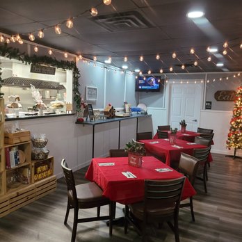 Sauce - a restaurant with red tablecloths and christmas decorations - Sicilian Near Me - Brodheadsville, Pennsylvania Sauce - a restaurant with red tablecloths and christmas decorations - Sicilian Near Me - Brodheadsville, Pennsylvania