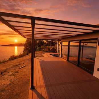 Sound Patio Solutions - A modern deck with a pergola overlooking the water during a golden sunset. - Patio Coverings Near Me - Edgewood, Washington Sound Patio Solutions - A modern deck with a pergola overlooking the water during a golden sunset. - Patio Coverings Near Me - Edgewood, Washington