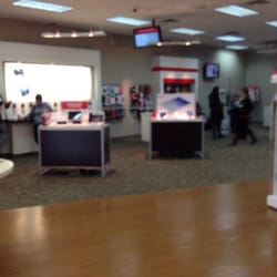 Verizon Wireless Authorized Retailer - People standing around waiting.
