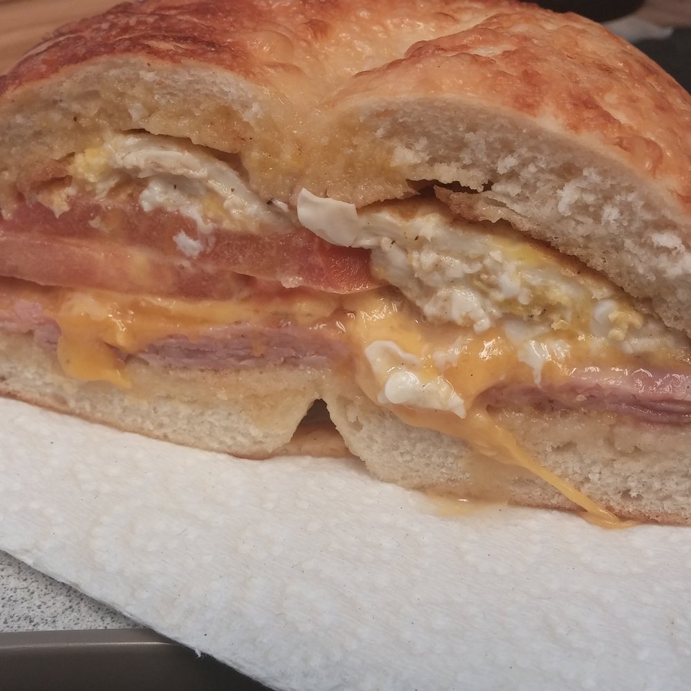 LA Bakery - Breakfast sandwich on bagel: ham, cheddar, tomato, and egg. - Bakeries Near Me - Carson City, Nevada