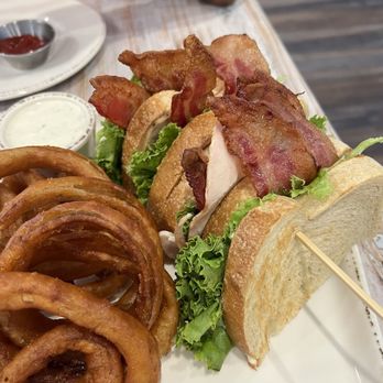 Farmhouse 78 - Triple sliced turkey bacon club with onion rings (extra charge) - American Near Me - Santa Ysabel, California Farmhouse 78 - Triple sliced turkey bacon club with onion rings (extra charge) - American Near Me - Santa Ysabel, California