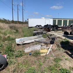 Just Hauling OBX - Mini storage grounds clean up in Powell's Point, NC before