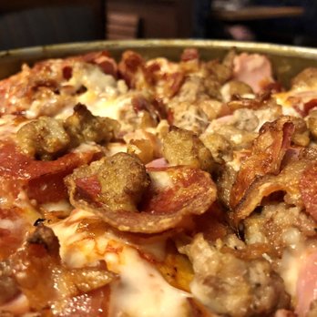 BJ's Restaurant & Brewhouse - a close up of a pizza - American Near Me - Orange, Ohio