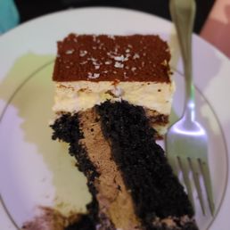 a piece of cake on a plate with a fork