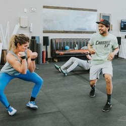 CrossFit E3 - Coach Caitlin and Coach Zacq having a dance-off!