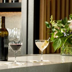 Amaterra Kitchen + Social Club - Bottle of Amaterra wine and a coctail on the bar at Amaterra Kitchen + Social Club.