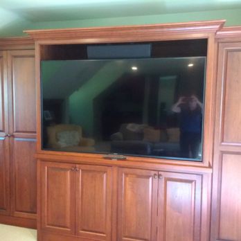 Home Audio/Video - Canapa job - 65-inch TV in cabinet on articulating mount, center channel speaker above. Tight tolerance - 1/4 inch around TV. - Home Theatre Installation Near Me