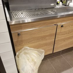 McDonald's - A bag of trash directly in front of the soda dispenser. Was there the entire time we were there