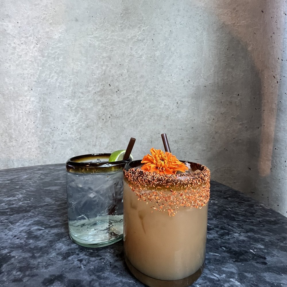 a glass with a drink in it