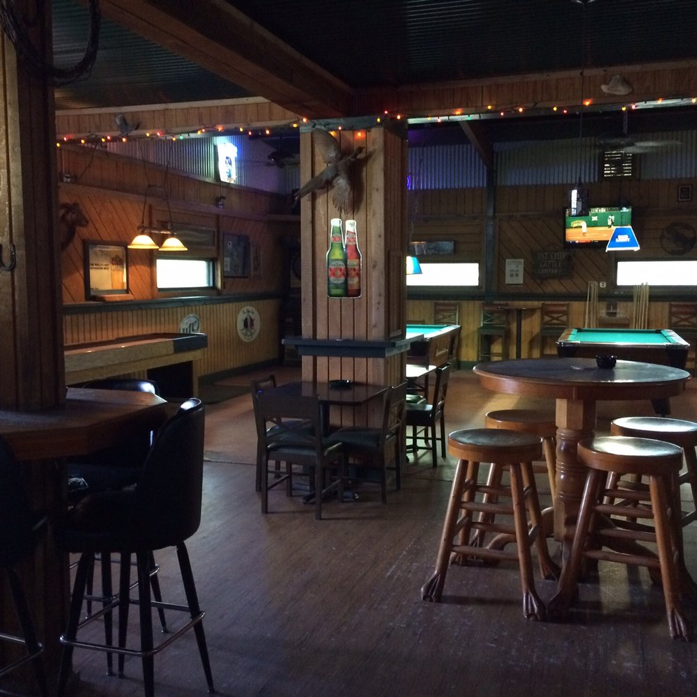 Longbranch Saloon - Pool tables, darts, shuffleboard table - Bars Near Me - Adkins, Texas