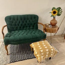 A purchased green velvet loveseat, with side table and foot stool (not from this shop)