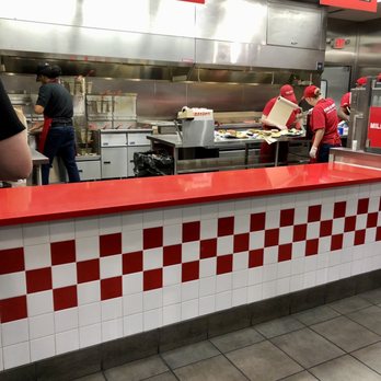 Five Guys - a restaurant kitchen with red and white checkered counter - Burgers Near Me - Louisville, Kentucky