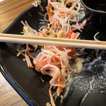 Dive - a plate of food with chopsticks and sauce - New American Near Me - Kismet, New York