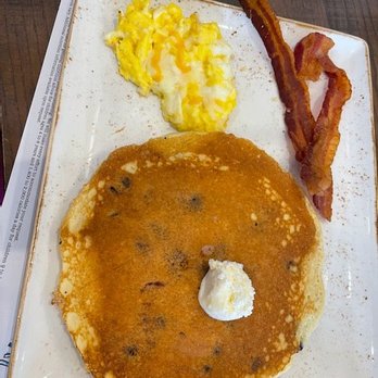 First Watch - Chocolate chip pancake scrabbled eggs and a side of bacon - Breakfast & Brunch Near Me - John's Creek, Georgia