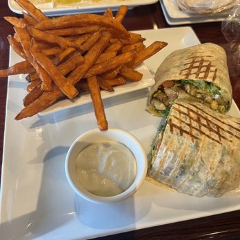 Mezza Grille - Shamsa spicy chicken wrap and sweet potato fries. - Mediterranean Near Me - Houston, Texas Mezza Grille - Shamsa spicy chicken wrap and sweet potato fries. - Mediterranean Near Me - Houston, Texas