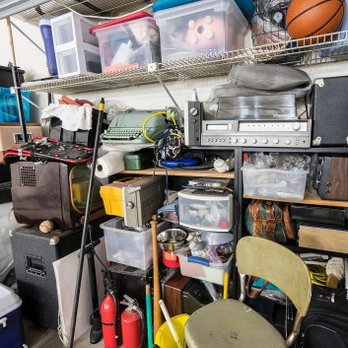 Acres Away - a cluttered garage with various items - Lawn Services Near Me Acres Away - a cluttered garage with various items - Lawn Services Near Me