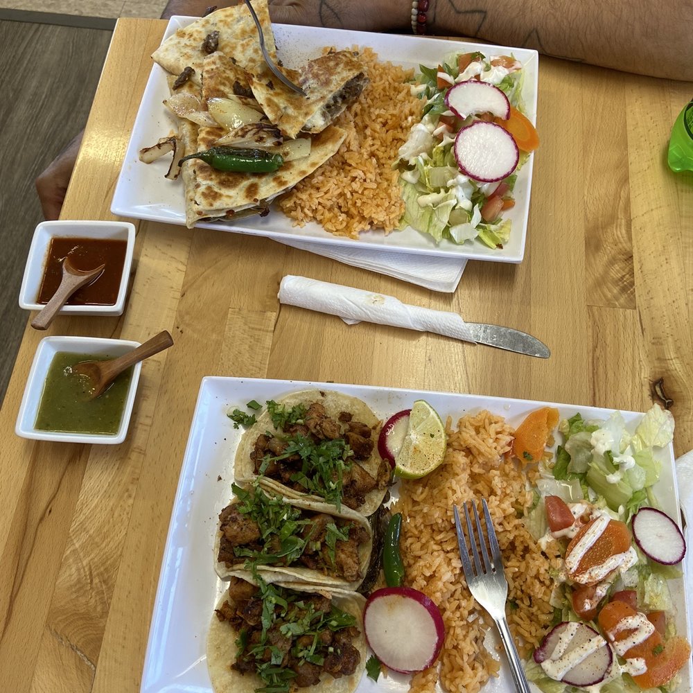 Steak quesadilla plate with salad substituted ,,  Chicken taco plate with sale substitute .  Red & green sauce .