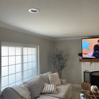Nogueda Empire - a living room with a flat screen tv - Flooring Near Me