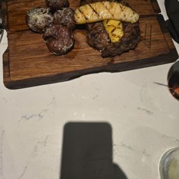 48 hour grilled pineapple ribeye- get medium rare! So succulent! Melts on the tongue. Came with parmesan and we're delicious!