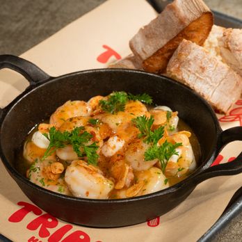 Tripping Animals Brewing - Camarones al Ajillo: Garlic-parsley shrimp with aioli, served with Cantabrian bread. - Breweries Near Me - Doral, Florida Tripping Animals Brewing - Camarones al Ajillo: Garlic-parsley shrimp with aioli, served with Cantabrian bread. - Breweries Near Me - Doral, Florida