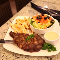 Sunset Bistro - You won't believe your eyes when you see our steak and fries!