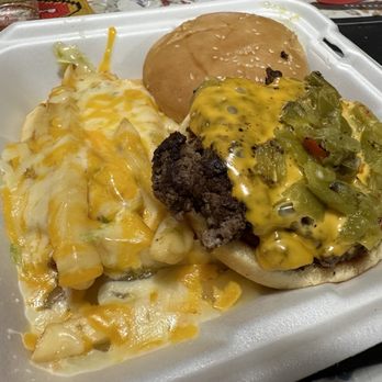 Desert Diamond - Burger with Chile cheese fries - A cheeseburger topped with green chili and cheese, served with cheese fries and a bun on a foam tray. - American Near Me - Socorro, New Mexico