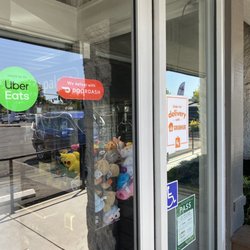 CH Cafe and Grill - Signs advertising delivery through UberEats, DoorDash, and GrubHub.