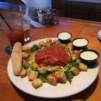 Pizza Pub - North Branch - a plate of salad with dressings - Pizza Near Me - North Branch, Minnesota Pizza Pub - North Branch - a plate of salad with dressings - Pizza Near Me - North Branch, Minnesota