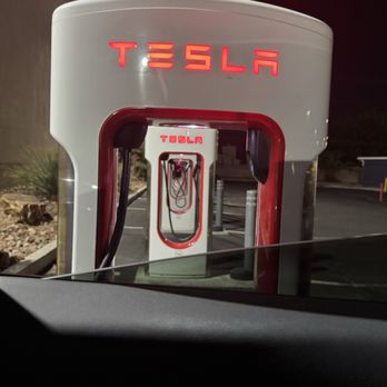 Tesla Supercharger - Tesla Supercharger charging stalls on a Saturday 7pm. - EV Charging Stations Near Me - Las Vegas, Nevada Tesla Supercharger - Tesla Supercharger charging stalls on a Saturday 7pm. - EV Charging Stations Near Me - Las Vegas, Nevada