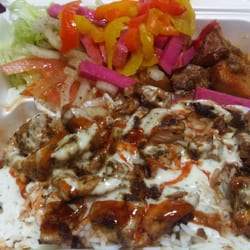 Chicken Souvlaki Plate with Basmati Rice, Salad, Roasted Potatoes, tzatziki and hot sauce