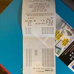 a receipt for a car that is parked on a table