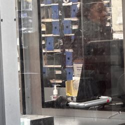 US Post Office - I tried to take this the best I could. This person is probably in her 20's/30s and refused to give me her name. She's black with dark hair.