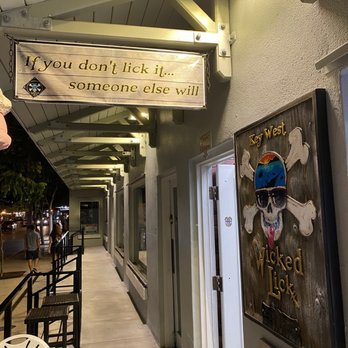 Wicked Lick - a hallway with a sign that says you don't lick if someone else will - Ice Cream & Frozen Yogurt Near Me - Key West, Florida