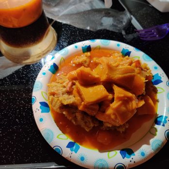 Caribe Restaurant - Mofongo with pork chicharon and mondongo on top Lawd Have Mercy! Plus Batido de papaya (papaya milk shake made with carnation milk) - Caribbean Near Me - Richmond, Virginia