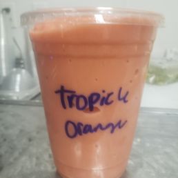 a smoothie in a plastic cup